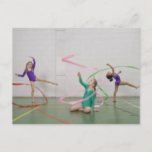 Gymnastics girls dancing with ribbons postcard