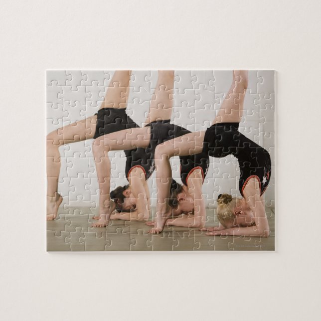 Gymnasts posing upside down jigsaw puzzle (Horizontal)