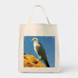 Gyrfalcon perched on a rock tote bag