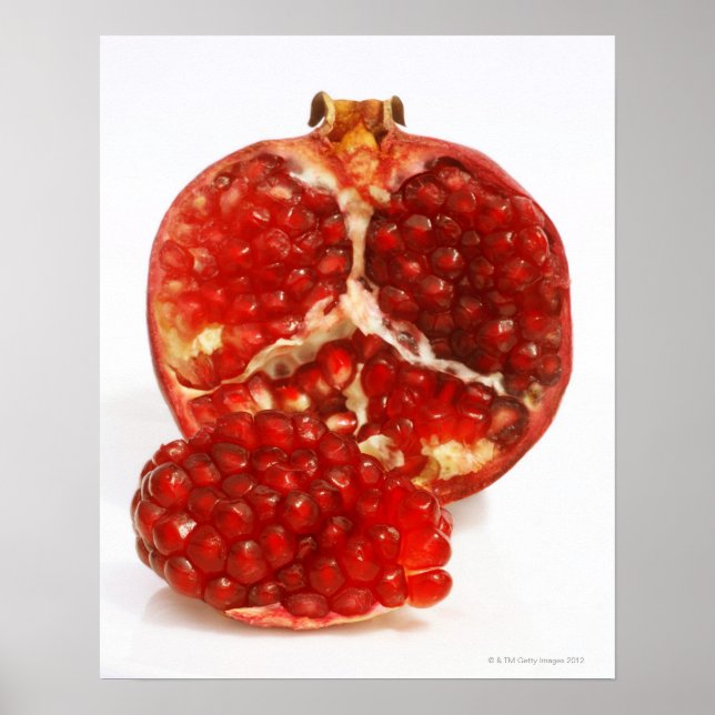 Half a ripe pomegranate cut to expose the juicy poster (Front)