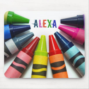 half circle of crayons on white mouse pad