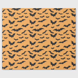 Halloween bats on orange background wrapping paper