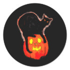 Halloween Black Cat on Glowing Orange Pumpkin