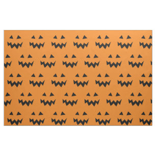 Halloween fabric with carved pumpkin face pattern