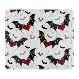 Halloween heart with black bat wings cutting board