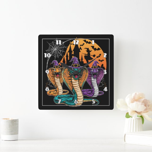 Halloween snakes in vibrant costumes at night square wall clock (Home)