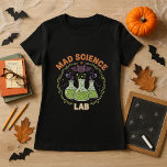 Halloween Teacher Mad Science Lab Spooky Chemistry T-Shirt<br><div class="desc">Make your classroom spookier this fall! This “Mad Science Lab” tee—with bubbling flasks, green potions, bats, and lab vibes—is perfect for science and chemistry teachers who want a fun Halloween STEM twist. | ✔ • 𝐓𝐡𝐞 ☛​̳"​̳𝙀​̳𝘿​̳𝙄​̳𝙏​̳ ​̳𝘿​̳𝙀​̳𝙎​̳𝙄​̳𝙂​̳𝙉​̳"​̳ ​̳𝙗​̳𝙪​̳𝙩​̳𝙩​̳𝙤​̳𝙣 𝐚𝐥𝐥𝐨𝐰𝐬 𝐲𝐨𝐮 𝐭𝐨 𝐩𝐞𝐫𝐬𝐨𝐧𝐚𝐥𝐢𝐳𝐞 𝐢𝐭. Please add your own unique text or...</div>