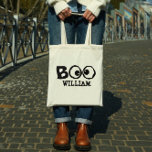 Halloween Trick or Treat Whimsical Cute Ghost Eye Tote Bag<br><div class="desc">Goofy-eyed BOO for your Halloween. A simple design with goofy cross-eyed ghoul eyes saying BOO! Trick or treat fun will be had by all with this whimsical design. Happy Halloween fun with a black background and a simple white border, Personalize for yourself or your favourite ghosts and goblins. This design...</div>
