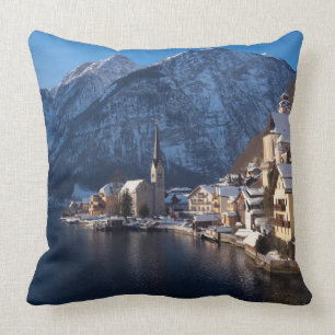 Hallstatt town in the snow in winter throw pillow