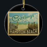 Hampton Beach Vintage Travel Ceramic Ornament<br><div class="desc">This Greetings From Hampton Beach vintage postcard design features a sandy beach with a beautiful turquoise ocean water and above the sea,  a blue sky with billowy white clouds. In vintage travels style.</div>