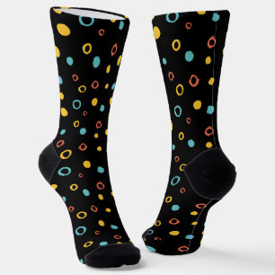 Hand drawn colourful circle pattern on a black  socks