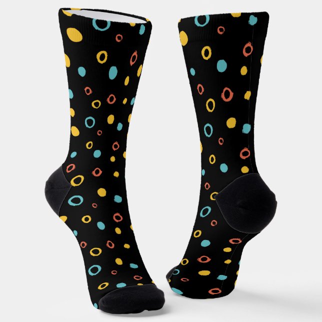 Hand drawn colourful circle pattern on a black  socks (Angled)