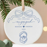 Hand Drawn Engaged Christmas Ceramic Ornament<br><div class="desc">Celebrate your love story with our "First Christmas Engaged" ornament, a perfect keepsake for newly engaged couples. This beautifully crafted ornament features a hand-drawn ribbon bow, a charming heart-shaped box, and a stunning engagement ring, symbolizing the beginning of your journey together. Hang it on your tree to cherish the memories...</div>