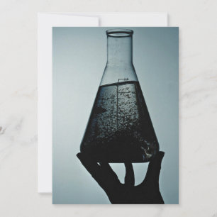 Hand holding an attractive laboratory beaker