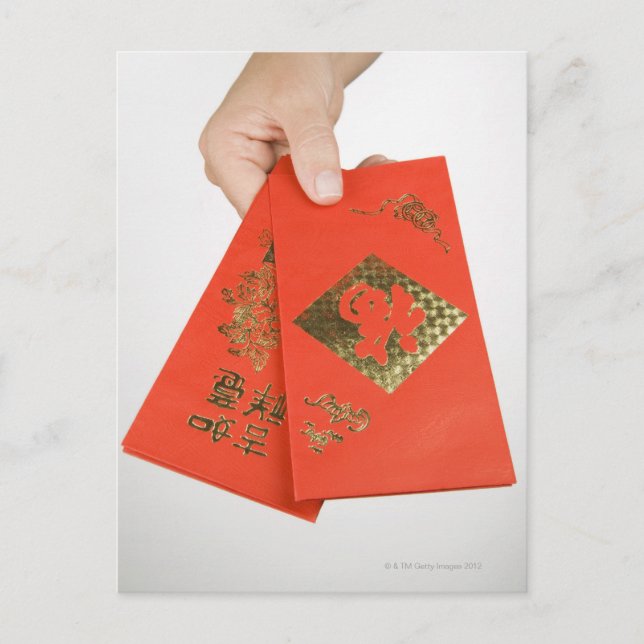 Hand holding Chinese money envelope Postcard (Front)
