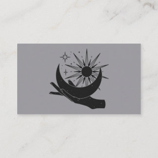 Hand holding moon and sun business card