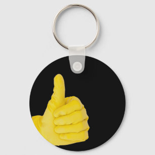 Hand in yellow latex glove keychain