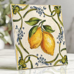 Hand-Painted Sicilian Lemons and Floral Vine Tile<br><div class="desc">Bring a taste of the Mediterranean to your home with this hand-painted design featuring vibrant Sicilian lemons, intertwining green vines, and delicate blue floral accents. The warm yellow and green tones, paired with a rustic, slightly textured background, create an elegant and timeless aesthetic. Perfect for backsplashes, accent walls, or adding...</div>