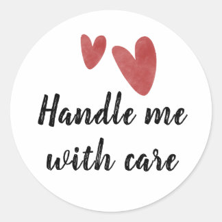 Handle me with care sticker with red heart