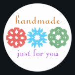"Handmade" holiday gift label<br><div class="desc">Cute,  classy gift label for the holidays,  featuring kids' snowflake cutouts.  Perfect for any homemade gift,  from a tin of cookies to a hand-knit scarf.  Personalize in a flash by replacing our sample name with yours.  Creators give half their proceeds to children's charities.</div>