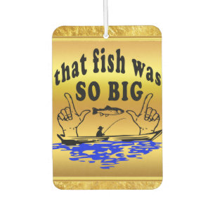 Hands apart showing a fish and a boat with water air freshener