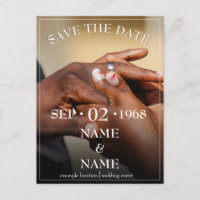 Hands of a coloured wedding couple pin on ring