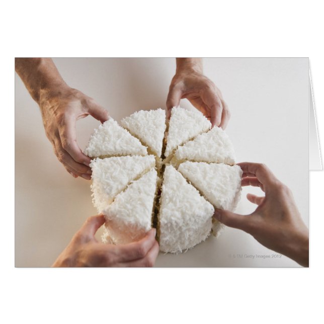 Hands pulling slices from cake (Front Horizontal)