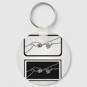 Hands showing the creation of Adam Keychain