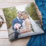 Handwritten Love Script Wedding Two Photo Throw Pillow<br><div class="desc">Add your own wedding photos to this square throw pillow. You can change the white and black colour of the handwriting style modern calligraphy "love" text to create your own wedding keepsake. Design ideas... change the text to a colour to match your wedding bouquet, or a colour to accent your...</div>