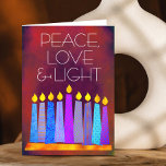 Hanukkah Blue Boho Candles on Red Peace Love Light Holiday Card<br><div class="desc">“Peace, love & light.” A playful, modern, artsy illustration of boho pattern candles in a menorah helps you usher in the holiday of Hanukkah. Assorted blue candles with colourful faux foil patterns overlay a rich, deep burnt red orange textured background. Feel the warmth and joy of the holiday season whenever...</div>