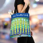 Hanukkah Blue Green Menorah Custom Name Trendy Tote Bag<br><div class="desc">A close-up photo of a bright, colourful, blue and green artsy menorah photo helps you usher in the holiday of Hanukkah in style. Feel the warmth and joy of the holiday season whenever you use this stunning, colourful Hanukkah personalized name tote bag. Matching cards, stickers, serving trays, and other products...</div>