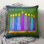 Hanukkah Bold Blue Candles Green Peace Love Light Throw Pillow<br><div class="desc">“Peace, love & light.” A playful, modern, artsy illustration of boho pattern candles in a menorah helps you usher in the holiday of Hanukkah. Assorted blue candles with colourful faux foil patterns overlay a rich, deep green textured background. Faux copper pattern foil on a rich dark green background for the...</div>