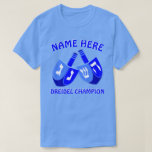 Hanukkah Dreidels In Blue Cute Dreidel Champion T-Shirt<br><div class="desc">Add a name to this funny Dreidel Champion Hanukkah tee shirt for a personalized gift or as a little treat for yourself. The bold graphic design of the two Dreidels in bright shades of blue and white includes a template for your name above with "Dreidel Champion" below, which can also...</div>