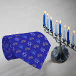 Hanukkah Gold Dreidel Star of David Menorah Blue Tie<br><div class="desc">Dress to impress this Hanukkah with our Gold Dreidel, Star of David, and Menorah tie! This tie is your perfect accessory for lighting up the festivities. With its elegant design featuring gold Dreidels, Stars of David, and Menorahs on a rich blue background, it adds a touch of sophistication to your...</div>