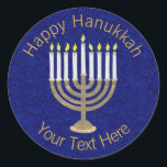 Hanukkah Gold Menorah On Rich Blue Background Classic Round Sticker<br><div class="desc">A classic Hanukiah design in gold and white on a deep blue faux sparkle background features space for your personalized text making this round sticker a unique addition to your Hanukkah celebrations. Use these Hanukkah stickers on mailings, scatter on a gift package or tuck them into favour bags as party...</div>
