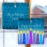 Hanukkah Menorah Candles Turquoise Keepsake Custom Ceramic Ornament<br><div class="desc">“Happy Hanukkah.” A playful, modern, artsy illustration of boho pattern candles helps you usher in the holiday of Hanukkah in style. Assorted blue candles with colourful faux foil patterns overlay a turquoise gradient to white textured background. On the back, personalize with your family name and year, over a tiny turquoise...</div>