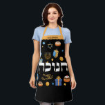 Hanukkah Personalized Hebrew Menorah Dreidel  Apron<br><div class="desc">Set a Happy Hanukkah tone with this Personalized Bold & Bright Hanukkah Apron. Sure to make someone special smile. It is the perfect way to wish friends and family a Happy Hanukkah. Whimsical colourful Chanukah elements — including Jelly Doughnuts, Dreidels, Wrapped Gifts, Gold Coins and Stars of David— surround the...</div>