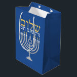 Hanukkah Shalom Peace on Earth Blue Medium Gift Bag<br><div class="desc">Hanukkah Shalom Peace on Earth Blue Gift Bag for all your holiday treats. Festive Hanukkah blue with a silver menorah and gold Shalom Peace On Earth. Easy to customize with text, fonts, and colours. Created by Zazzle pro designer BK Thompson exclusively for Kate’s Creations; please contact us if you need...</div>