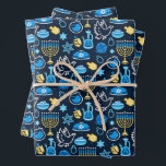 Hanukkah Symbols Blue Pattern Wrapping Paper Sheet<br><div class="desc">Celebrate the Festival of Lights with this Hanukkah-themed pattern. Featuring traditional symbols like menorahs,  dreidels,  doves,  and Stars of David,  all in vibrant blue,  gold,  and white hues,  this design is perfect for festive products. Ideal for Hanukkah wrapping paper,  greeting cards,  and other holiday decor.</div>