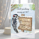 Happy 40th Birthday Downy Woodpecker Card<br><div class="desc">Celebrate a milestone with this Happy 40th Birthday bird-themed greeting card, featuring a hand-painted Downy Woodpecker carefully pecking a rustic wooden Happy Birthday sign. Illustrated in watercolor and pen, the artwork captures a calm, nature-inspired moment with thoughtful detail and timeless charm. Perfect for marking a 40th birthday milestone, this nature-inspired...</div>