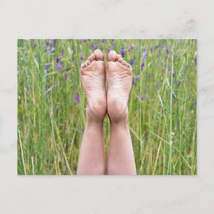 happy bare feet in wildflowers postcard