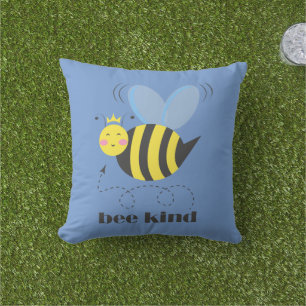 Happy bee princess with crown and slogan Bee Kind Outdoor Pillow