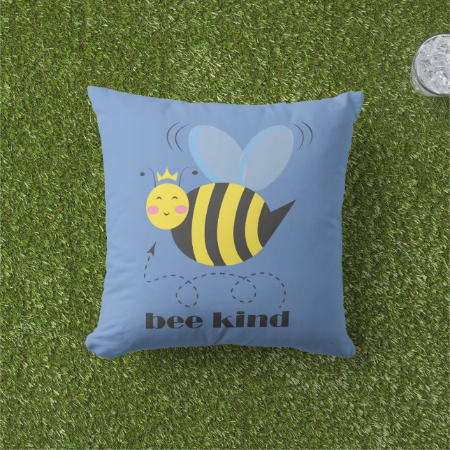 Happy bee princess with crown and slogan Bee Kind Outdoor Pillow (Grass)