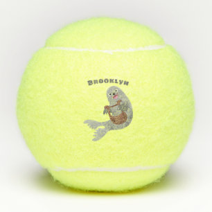 Happy cute harp seal cartoon illustration tennis balls