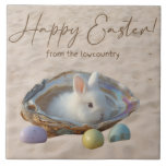 Happy Easter Lowcountry Oyster Shell and Bunny Tile<br><div class="desc">Happy Easter Lowcountry style! The design on this beautiful Lowcountry Easter ceramic tile features an oyster shell in the sand with a white bunny rabbit and three pastel colored Easter eggs. The text reads "Happy Easter from the Lowcountry." The decorative tile/trivet is perfect for Easter brunch or holiday gatherings with...</div>