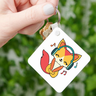 Happy fox with headphones listening to music.  keychain
