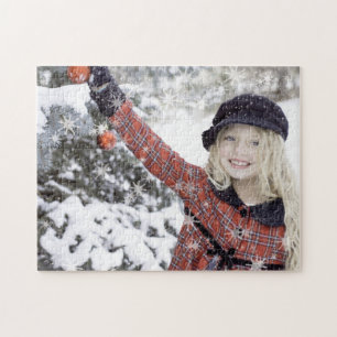 Happy girl decorating Christmas tree Jigsaw Puzzle