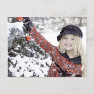 Happy girl decorating Christmas tree Postcard