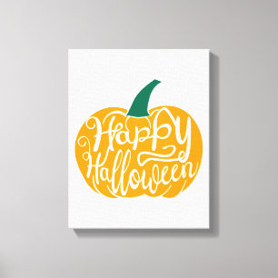 Happy Halloween lettering on carved pumpkin Canvas Print