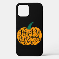 Happy Halloween lettering on carved pumpkin